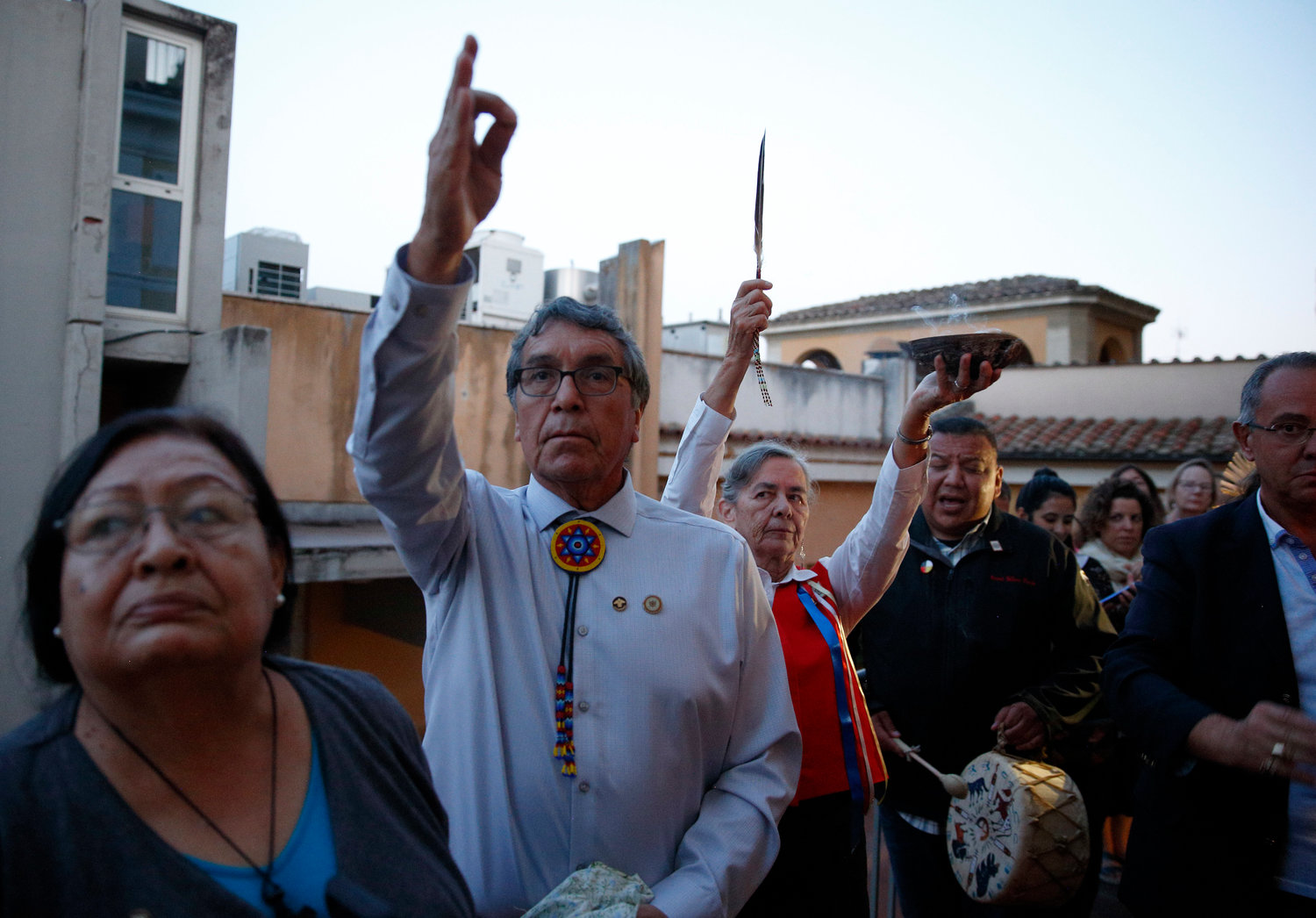 People participate in an indigenous prayer during a meeting of indigenous peoples from North and South America at the Jesuit General Curia in Rome Oct. 17, 2019. The meeting was a side event to the Synod of Bishops for the Amazon. Among those pictured from left are Rita Means, tribal council representative with the Rosebud Sioux Tribe; Rodney Bordeaux, president of the Rosebud Sioux Tribe; and Sister Priscilla Soloman, a member of the Ojibway people and of the Sisters of St. Joseph of Sault Ste. Marie in Ontario, Canada.